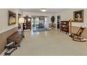 Spacious living area with neutral walls and floors, offering a versatile space for personalization and decor at 444 Driftwood Rd, Venice, FL 34293
