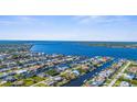 Expansive aerial view of a waterfront community showcasing beautiful homes with access to the tranquil river at 5265 Neville Ter, Port Charlotte, FL 33981