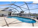 Beautiful pool area with serene water views and an open-air design at 5265 Neville Ter, Port Charlotte, FL 33981