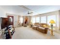 Bright living room with comfortable seating, ample natural light, and a ceiling fan at 5619 Bayshore Rd # 421, Palmetto, FL 34221