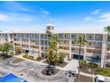 Building exterior view showcases ample parking and a well-maintained exterior, enhancing curb appeal and convenience at 8403 Placida Rd # 304, Placida, FL 33946