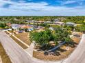 A peaceful community with homes along canals, lush greenery, and serene streets at 13648 Clara Ln, Port Charlotte, FL 33981