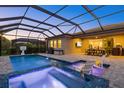 Stunning outdoor pool and patio area with a screened enclosure, perfect for relaxation and entertaining at 20591 Ovid Ln, Venice, FL 34293