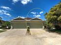 Charming townhome featuring attached garages, lovely landscaping, and well-manicured lawns at 275 Capulet Dr, Venice, FL 34292