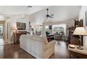 Comfortable living room featuring vaulted ceilings and hardwood flooring at 2834 Coolidge Ave, North Port, FL 34286