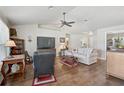 Bright living room featuring vaulted ceilings and hardwood flooring at 2834 Coolidge Ave, North Port, FL 34286