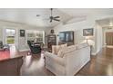 Comfortable living room featuring vaulted ceilings and hardwood flooring at 2834 Coolidge Ave, North Port, FL 34286