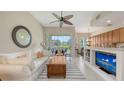 Inviting living room featuring comfortable seating, stylish decor, and sliding glass doors to outdoor space at 301 Ravinia Cir # 301B2, Venice, FL 34292