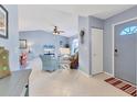 Welcoming foyer features tile flooring and leads into the spacious living area at 3181 E Village Dr, Venice, FL 34293