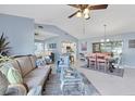 Open-concept layout seamlessly connects the living room, dining area, and kitchen at 3181 E Village Dr, Venice, FL 34293