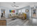 Inviting living room boasts light gray floors, neutral walls, and comfortable seating area near the entry at 3355 Roslyn Rd, Venice, FL 34293