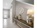 Inviting entryway with neutral paint, a console table, and decorative accents at 4523 Birdsong Dr, Palmetto, FL 34221