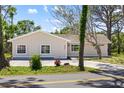 Charming single-story home with a well-maintained lawn and inviting curb appeal at 5992 Osprey Rd, Venice, FL 34293