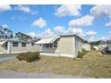 Charming home with awnings and manicured lawn offering a comfortable and inviting curb appeal at 6451 Keena Ct, North Port, FL 34287