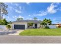 Well-maintained single Gathering home with an attached garage and landscaping at 307 Bucknell Rd, Venice, FL 34293