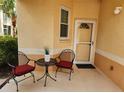 Inviting front porch with outdoor seating, creating a cozy space to welcome guests at 4213 Vicenza Dr # A2, Venice, FL 34293
