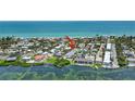 Aerial shot of the property, showcasing its proximity to the beach and surrounding neighborhood in a waterfront community at 5031 N Beach Rd # 118, Englewood, FL 34223