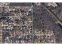Residential area featuring lush tree cover with a neighborhood street layout at 5106 S Lockwood Ridge Rd, Sarasota, FL 34231