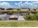 Scenic waterfront view featuring a private dock and access to the canal at 798 Fairmount Dr, North Port, FL 34287