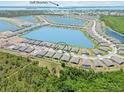 Beautiful aerial view of the community, showcasing the lakes, nearby beaches, and landscaping at 8529 Saint Kitts Cir, Englewood, FL 34224
