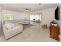 Bright living room with tile flooring, neutral paint, and comfortable seating area at 929 Cypress Ave, Venice, FL 34285