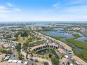 Gorgeous aerial view of the condo buildings in a scenic location near lakes and beaches at 1156 Bird Bay Way # 104, Venice, FL 34285