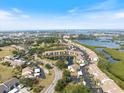 Aerial view of a beautiful community with golf course and waterfront property at 1190 Bird Bay Way # 309, Venice, FL 34285