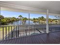 Large screened porch overlooking a waterfront view, the boat lift, and the large pool at 13314 Prentice Ave, Port Charlotte, FL 33953