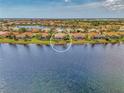 This home offers a peaceful lake view and private backyard at 138 Rimini Way, North Venice, FL 34275