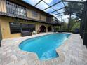Expansive screened-in pool area with a covered patio and multiple seating options at 236 Cory St, Port Charlotte, FL 33953