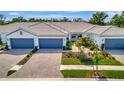 Charming single-story home with well-maintained landscaping and a brick driveway, perfect for easy living at 25069 Pearl Lake Cir, Englewood, FL 34223