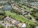 Gorgeous aerial view of the property, highlighting its location on the golf course at 396 Lansbrook Dr, Venice, FL 34292