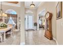 Inviting foyer with tile floors, high ceilings, and elegant decor leading to living spaces at 4403 Via Del Villetti Dr, Venice, FL 34293