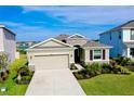 Inviting one-story home with a two-car garage, stone veneer, and beautiful landscaping at 5222 Granite Dust Pl, Palmetto, FL 34221