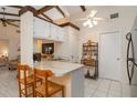 Cozy kitchen featuring breakfast bar seating and easy access to living spaces at 5559 Brassy Loop, North Port, FL 34287
