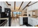 Bright kitchen with ample countertop space open to the dining and living areas at 5559 Brassy Loop, North Port, FL 34287