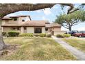 Charming townhouse featuring well-maintained landscaping and a welcoming entrance at 5559 Brassy Loop, North Port, FL 34287