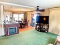 Cozy living room with a fireplace and seamlessly connected to the dining area at 603 Leisure, Venice, FL 34285