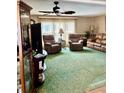 Inviting living room with plush seating, ceiling fan, and natural light at 603 Leisure, Venice, FL 34285