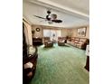 Inviting living room with plush seating, ceiling fan, and natural light at 603 Leisure, Venice, FL 34285