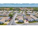 This is an aerial view of a cozy single-story home in a charming neighborhood with well-maintained streets at 710 Ironwood Dr # 165, Venice, FL 34292