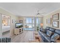 A comfortable living room with ocean views and a peek into the Primary bedroom at 950 Tarpon Center Dr # 504, Venice, FL 34285