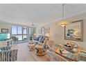 Relaxing living room with waterfront views, comfortable furniture, and a dining area at 950 Tarpon Center Dr # 504, Venice, FL 34285