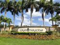Elegant entrance sign for the Gran Paradiso community, surrounded by lush landscaping at 12728 Richezza Dr, Venice, FL 34293