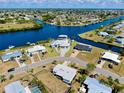 Stunning aerial view of waterfront homes along a scenic canal community at 140 Poinsettia Ne Cir, Port Charlotte, FL 33952