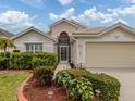 Well-maintained single-story home featuring a lovely garden and a two-car garage at 143 Braemar Ave, Venice, FL 34293