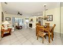 Spacious living room featuring a fireplace, tile floors and an open floor plan at 143 Braemar Ave, Venice, FL 34293