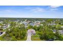 Aerial view of a charming neighborhood featuring lush greenery and well-maintained homes at 2267 Yalta Ter, North Port, FL 34286