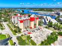 High-angle shot of the Venice Costa Brava showing the ample parking and community in a coastal setting at 232 Saint Augustine Ave # 505, Venice, FL 34285