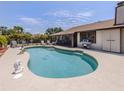 Inviting outdoor pool with screened lanai, grill, and lush landscaping, perfect for entertaining at 2331 Mission Valley Blvd, Nokomis, FL 34275